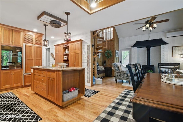 141 Arrowhead Cir, Newfoundland, PA 18445 - kitchen featuring open shelves, a wood stove, wall oven, open floor plan, and recessed lighting