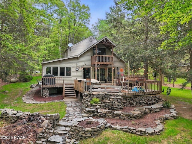 141 Arrowhead Cir, Newfoundland, PA 18445 - back of house featuring a balcony and a deck