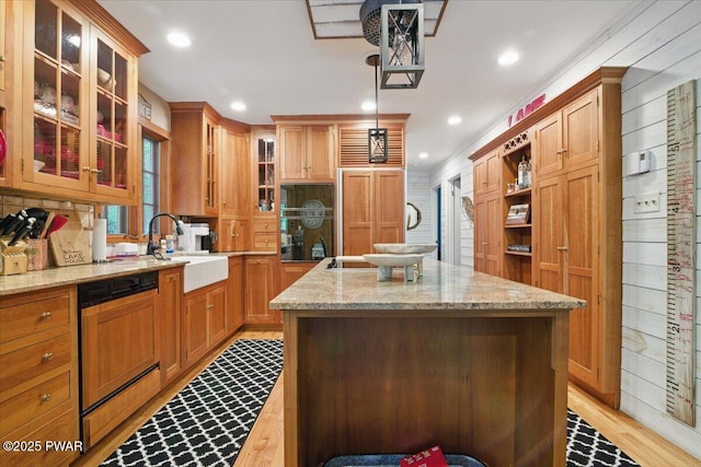 141 Arrowhead Cir, Newfoundland, PA 18445 - kitchen featuring dishwashing machine, a center island, recessed lighting, a sink, and light stone counters