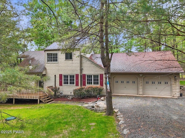 141 Arrowhead Cir, Newfoundland, PA 18445 - view of front of property featuring a front lawn, a garage, roof with shingles, a wooden deck, and driveway