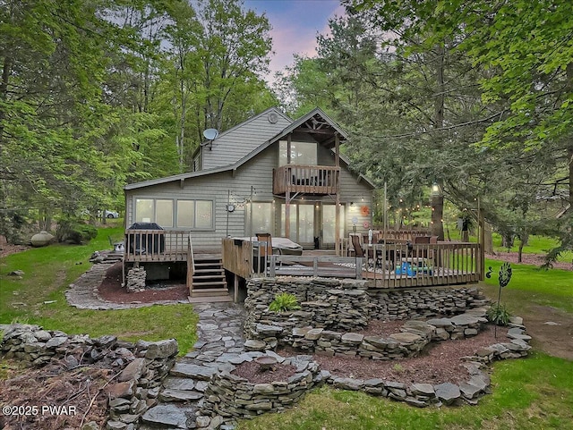 141 Arrowhead Cir, Newfoundland, PA 18445 - back of property with a balcony and a wooden deck