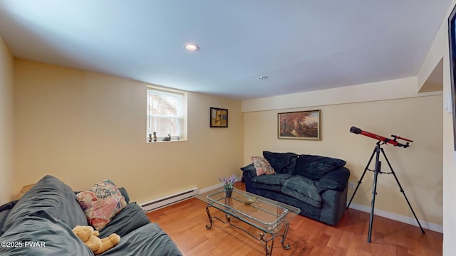 living room with baseboard heating, recessed lighting, wood finished floors, and baseboards