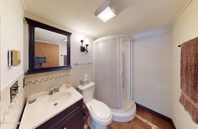 full bath with tasteful backsplash, toilet, a shower stall, vanity, and tile patterned flooring