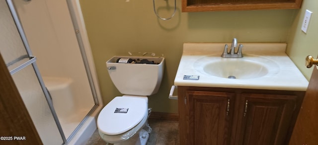 bathroom with toilet, vanity, and tile patterned flooring