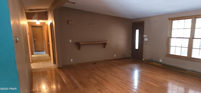 unfurnished living room featuring light wood-type flooring