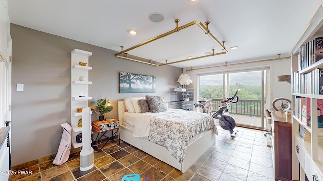 149 Bennett Ave Unit J, Milford, PA 18337 - bedroom with access to exterior, recessed lighting, and dark stone finish flooring