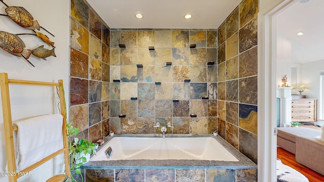 149 Bennett Ave Unit J, Milford, PA 18337 - full bathroom featuring a garden tub, recessed lighting, tile walls, and wood finished floors