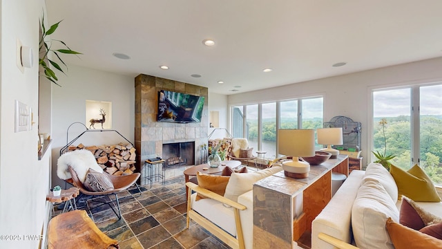 149 Bennett Ave Unit J, Milford, PA 18337 - living room with plenty of natural light, a tile fireplace, recessed lighting, and dark stone finish flooring
