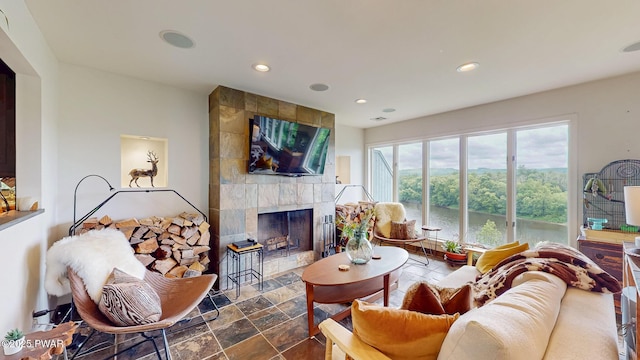149 Bennett Ave Unit J, Milford, PA 18337 - living area with a tile fireplace, recessed lighting, and dark stone finish floors