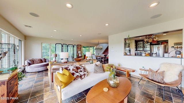 149 Bennett Ave Unit J, Milford, PA 18337 - living area with a chandelier, stone tile flooring, and recessed lighting
