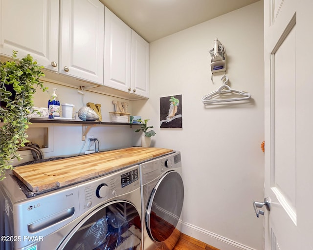 149 Bennett Ave Unit J, Milford, PA 18337 - washroom with washer and dryer, cabinet space, and wood finished floors