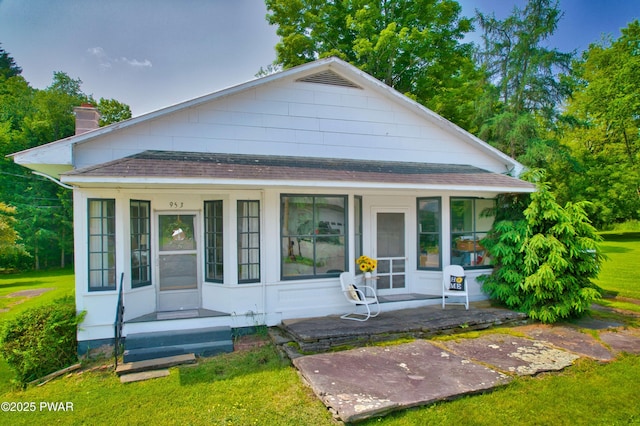 953 Creek Dr, Prompton, PA 18456 - view of front of property featuring a shingled roof, a chimney, a front lawn, and a porch