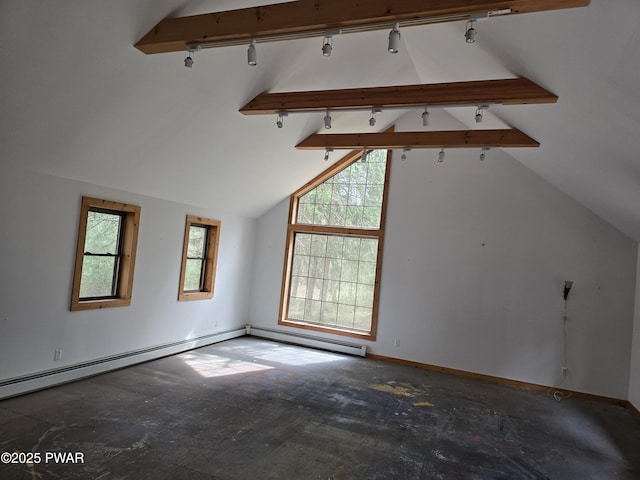 additional living space featuring baseboards and vaulted ceiling with beams