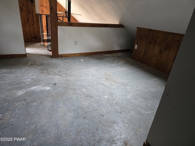 additional living space featuring lofted ceiling