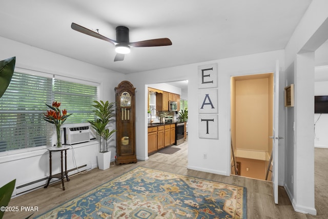 4 Pebble Ct, Lake Ariel, PA 18436 - bedroom with cooling unit, a baseboard heating unit, light wood-style floors, and a sink