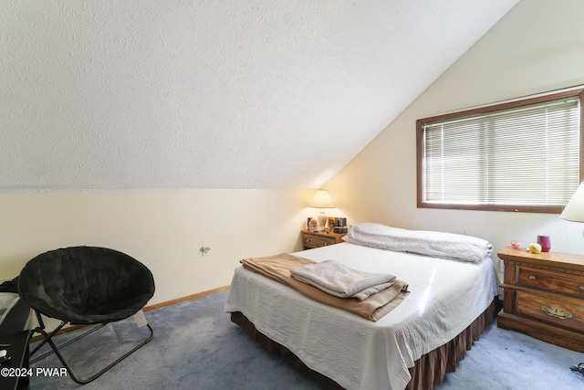 bedroom with carpet flooring, a textured ceiling, and lofted ceiling