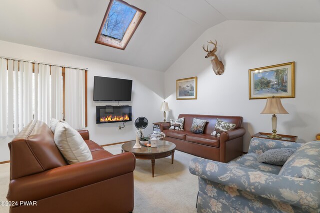 living room with carpet and lofted ceiling with skylight