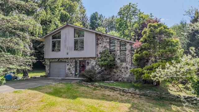 20 Clemen V Muller St, Beach Lake, PA 18405 - view of front of house with stone siding, driveway, a garage, and a front yard
