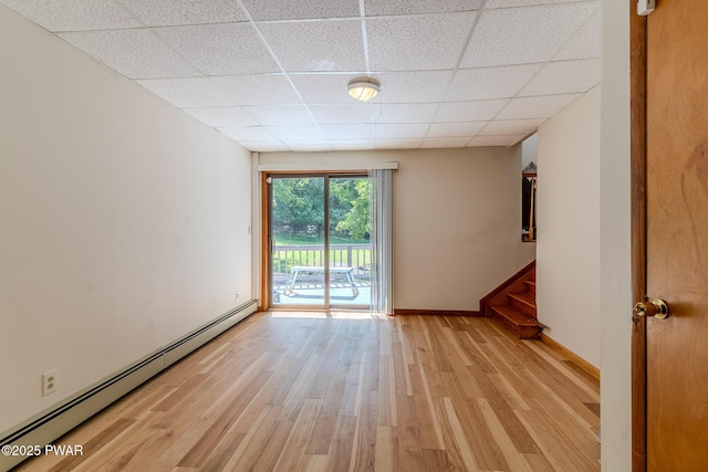 20 Clemen V Muller St, Beach Lake, PA 18405 - unfurnished room featuring a baseboard radiator, a paneled ceiling, light wood-style floors, and stairway