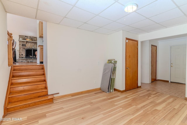 20 Clemen V Muller St, Beach Lake, PA 18405 - unfurnished room featuring light wood-type flooring, a drop ceiling, and stairs