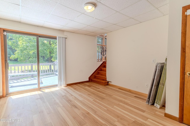 20 Clemen V Muller St, Beach Lake, PA 18405 - empty room featuring light wood-type flooring, a drop ceiling, and stairway