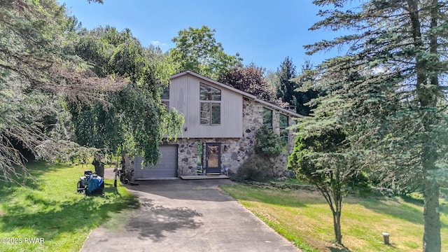 20 Clemen V Muller St, Beach Lake, PA 18405 - view of front facade with stone siding, driveway, a garage, and a front yard