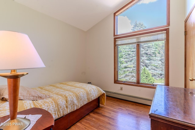 20 Clemen V Muller St, Beach Lake, PA 18405 - bedroom with a baseboard heating unit, wood finished floors, and vaulted ceiling