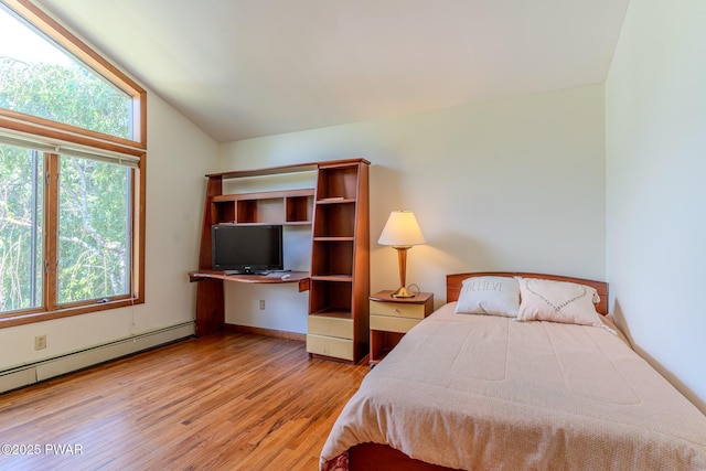 20 Clemen V Muller St, Beach Lake, PA 18405 - bedroom featuring wood finished floors, vaulted ceiling, and a baseboard heating unit