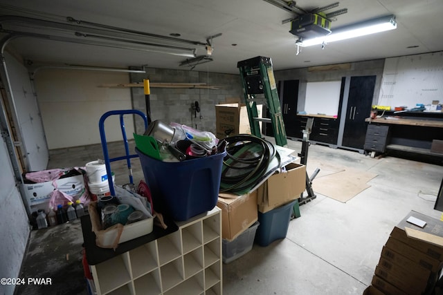 garage featuring a workshop area and a garage door opener