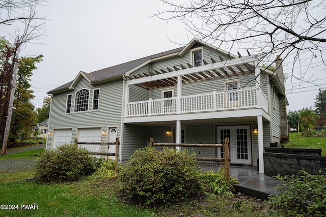 back of property with a garage