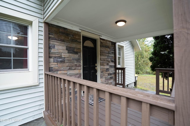 view of exterior entry featuring a porch