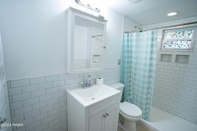 bathroom featuring vanity, tile walls, and a shower with shower curtain