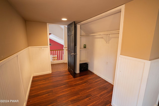 unfurnished bedroom featuring dark hardwood / wood-style flooring and a closet