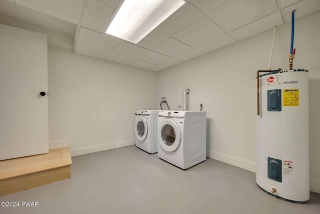 laundry room with washer and dryer and electric water heater