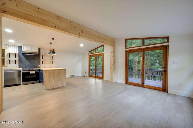 kitchen with french doors, stainless steel appliances, decorative light fixtures, vaulted ceiling with beams, and light hardwood / wood-style floors