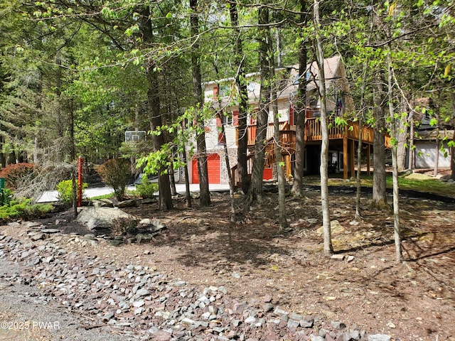 view of yard featuring a wooden deck