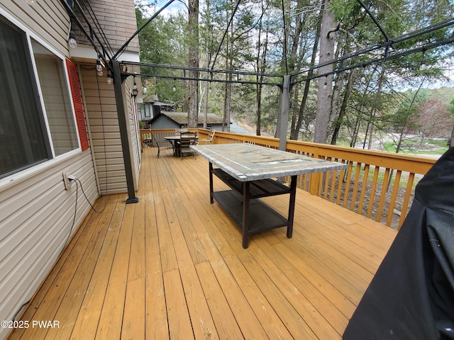 deck with outdoor dining area