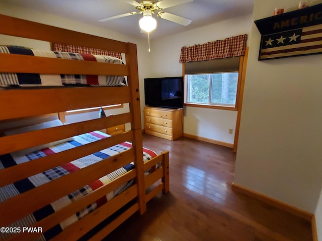 bedroom with dark hardwood / wood-style floors