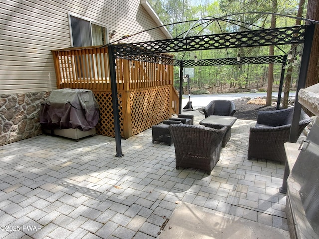 view of patio / terrace featuring an outdoor hangout area, a deck, and area for grilling