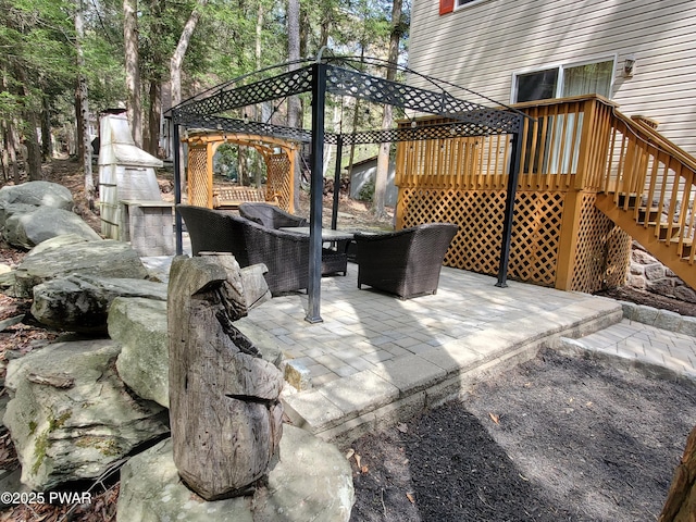 view of patio / terrace with a gazebo, a deck, and stairway