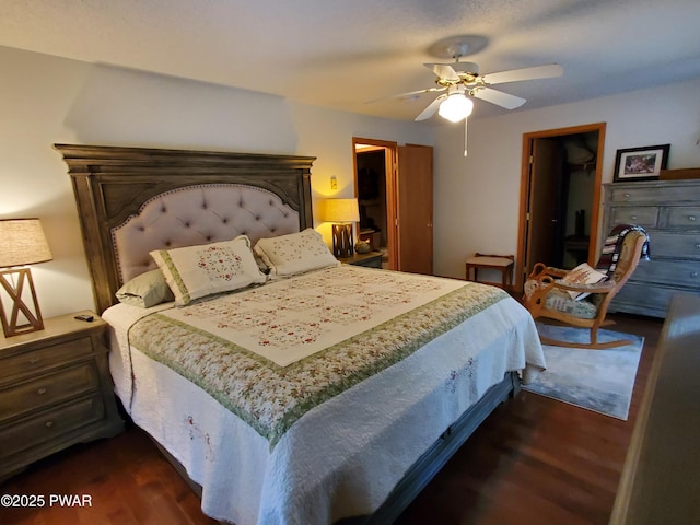 bedroom with dark hardwood / wood-style floors and ceiling fan