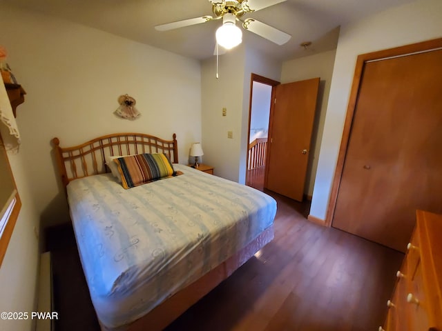 bedroom with ceiling fan and wood-type flooring