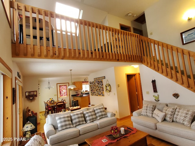 living room featuring hardwood / wood-style floors and a high ceiling