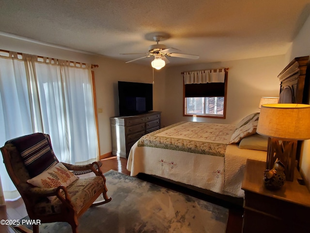 bedroom featuring a textured ceiling and ceiling fan