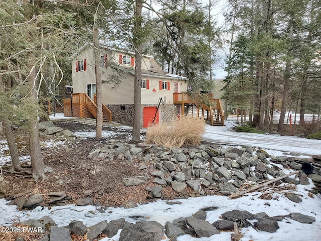 snowy yard with a wooden deck