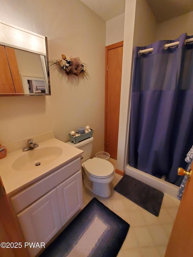 bathroom with vanity, a shower with curtain, and toilet