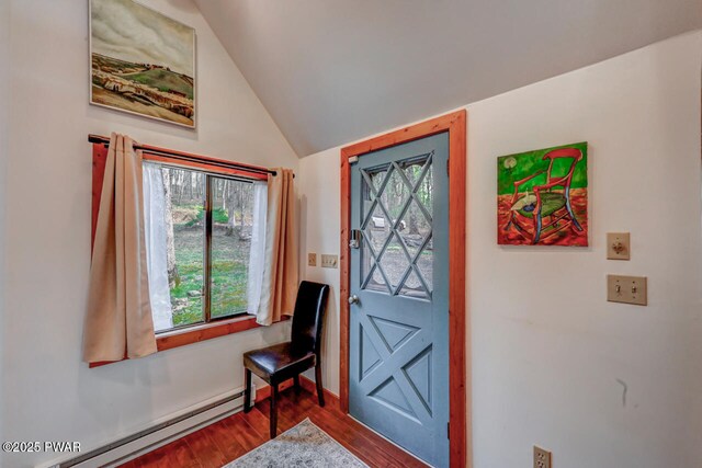 3218 Bluebird Dr, Bushkill, PA 18324 - entryway with baseboard heating, dark wood finished floors, and lofted ceiling