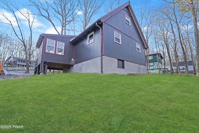 view of side of home featuring a yard