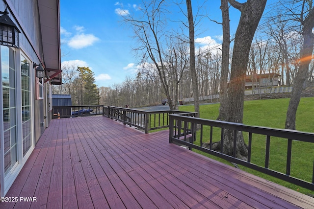 deck featuring a lawn