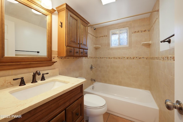 full bathroom featuring toilet, tile walls, tile patterned flooring, bathtub / shower combination, and vanity